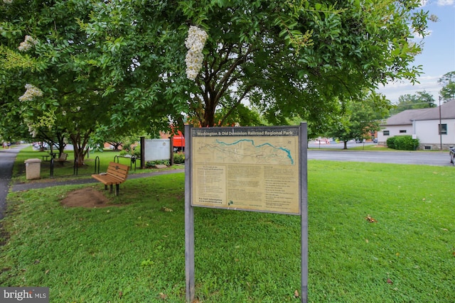 view of property's community with a lawn