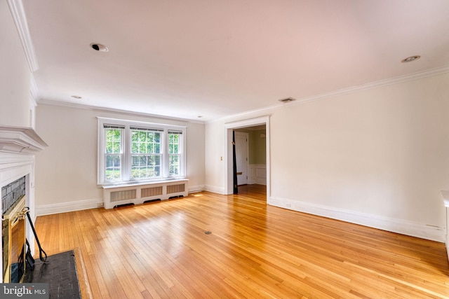 2305 Macdonough Rd, Wilmington, DE 19805 - unfurnished living room featuring radiator heating unit, a fireplace with flush hearth, light wood-style floors, crown molding, and baseboards
