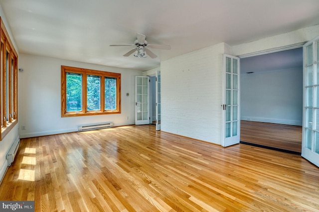 2305 Macdonough Rd, Wilmington, DE 19805 - spare room featuring a baseboard heating unit, a ceiling fan, light wood-style flooring, french doors, and baseboards
