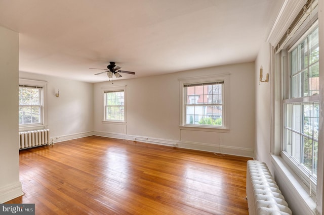 2305 Macdonough Rd, Wilmington, DE 19805 - unfurnished room featuring radiator, light wood-style flooring, baseboards, and ceiling fan