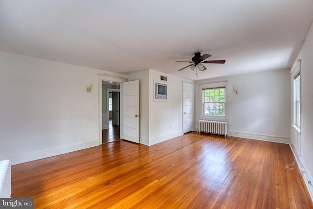 2305 Macdonough Rd, Wilmington, DE 19805 - spare room with radiator, light wood finished floors, ceiling fan, and baseboards
