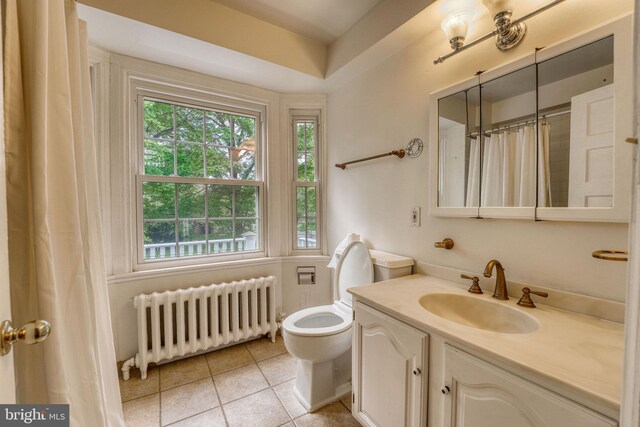 2305 Macdonough Rd, Wilmington, DE 19805 - full bathroom with radiator heating unit, tile patterned flooring, vanity, toilet, and curtained shower