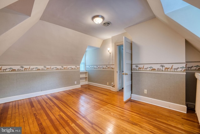 2305 Macdonough Rd, Wilmington, DE 19805 - bonus room featuring hardwood / wood-style floors, vaulted ceiling, baseboards, and wainscoting