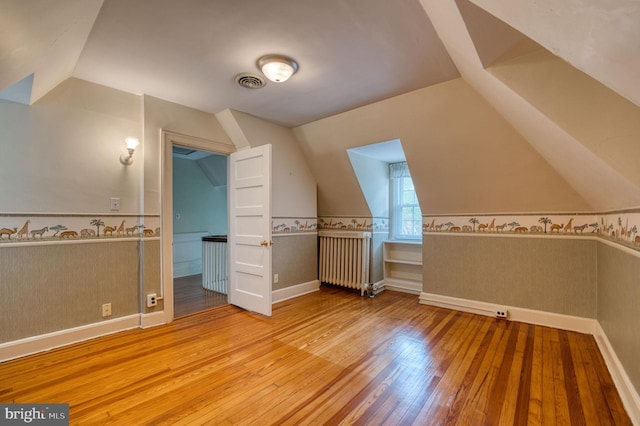 2305 Macdonough Rd, Wilmington, DE 19805 - bonus room with radiator, lofted ceiling, wood finished floors, wainscoting, and baseboards