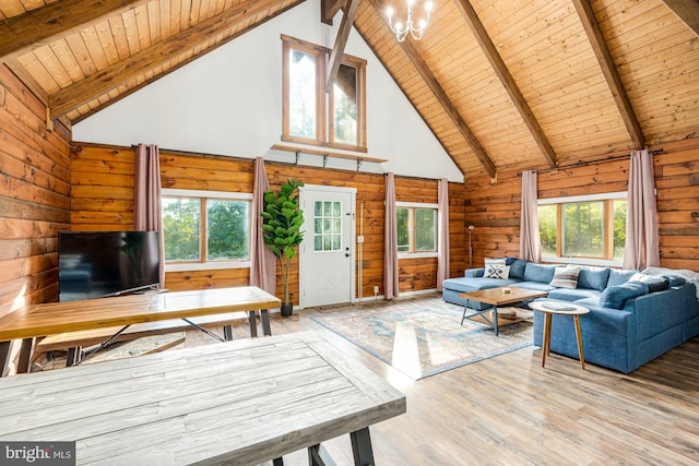 1276 Birch Grove Ln, Berkeley Springs, WV 25411 - living room featuring wooden ceiling, high vaulted ceiling, wooden walls, beam ceiling, and a chandelier