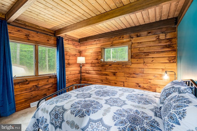 1276 Birch Grove Ln, Berkeley Springs, WV 25411 - carpeted bedroom with wooden ceiling, beamed ceiling, and wood walls