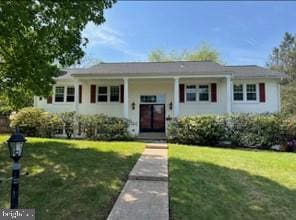 bi-level home with a front lawn