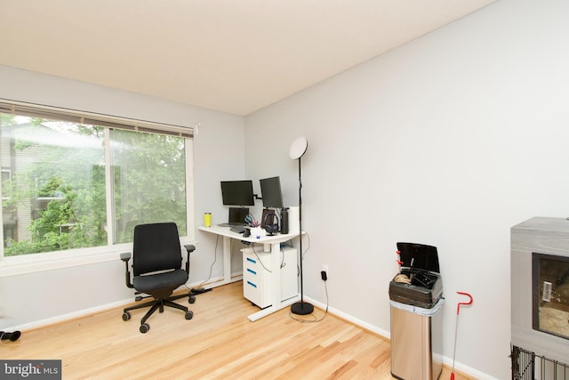 7313 Split Rail Ln, Laurel, MD 20707 - home office featuring light wood-style floors, plenty of natural light, and baseboards