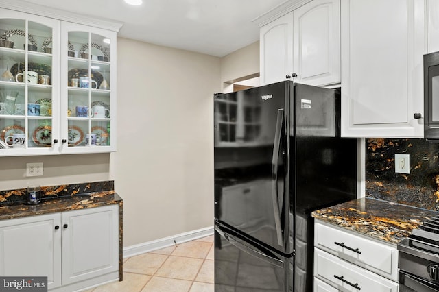 12904 Two Farm Dr, Silver Spring, MD 20904 - kitchen featuring freestanding refrigerator, light tile patterned floors, glass insert cabinets, white cabinetry, and dark stone counters