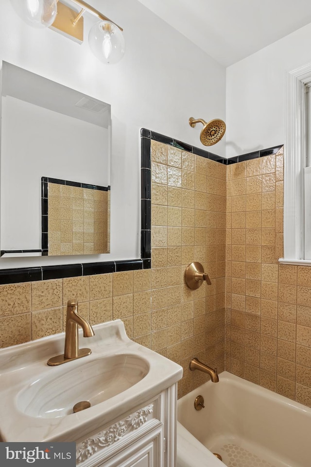 12904 Two Farm Dr, Silver Spring, MD 20904 - bathroom featuring tile walls, shower / tub combination, and vanity