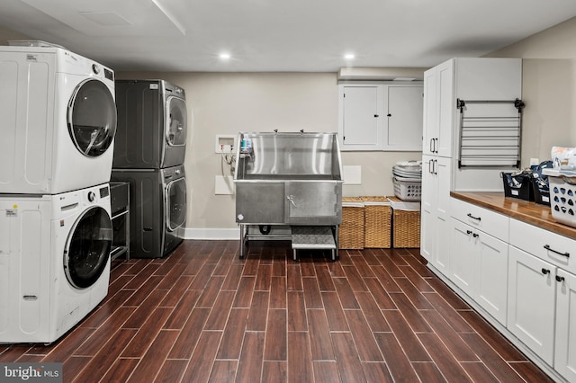 12904 Two Farm Dr, Silver Spring, MD 20904 - laundry area with stacked washer and clothes dryer, recessed lighting, dark wood finished floors, and baseboards
