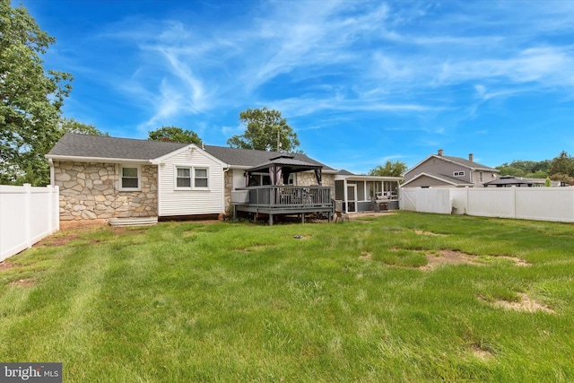 607 Jays Ln, Pottstown, PA 19464 - back of property featuring stone siding, a gazebo, a sunroom, a fenced backyard, and a wooden deck