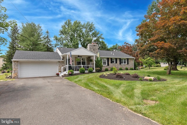 607 Jays Ln, Pottstown, PA 19464 - ranch-style home featuring stone siding, a porch, a front yard, and asphalt driveway