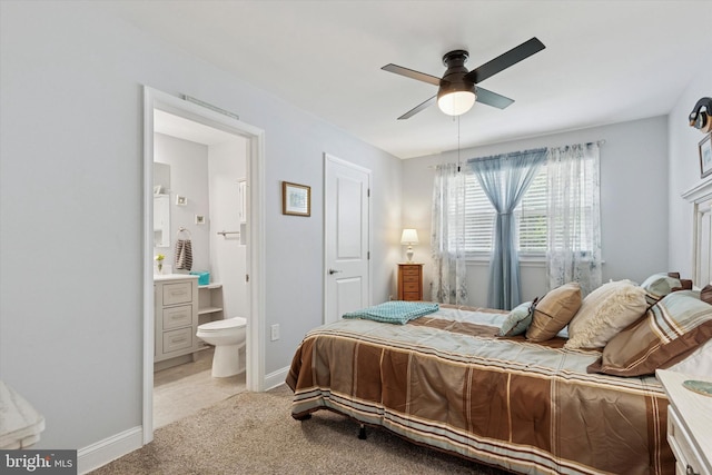607 Jays Ln, Pottstown, PA 19464 - bedroom with light colored carpet, ensuite bath, and a ceiling fan