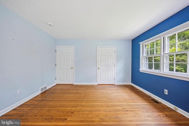 343 Michigan Ave, Swarthmore, PA 19081 - unfurnished bedroom with baseboards and wood finished floors