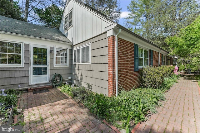 343 Michigan Ave, Swarthmore, PA 19081 - view of home's exterior with a patio, brick siding, and board and batten siding