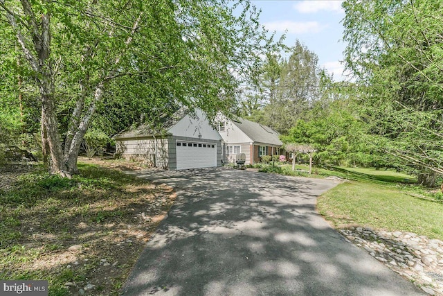 343 Michigan Ave, Swarthmore, PA 19081 - view of front of house featuring driveway, a front yard, and a garage