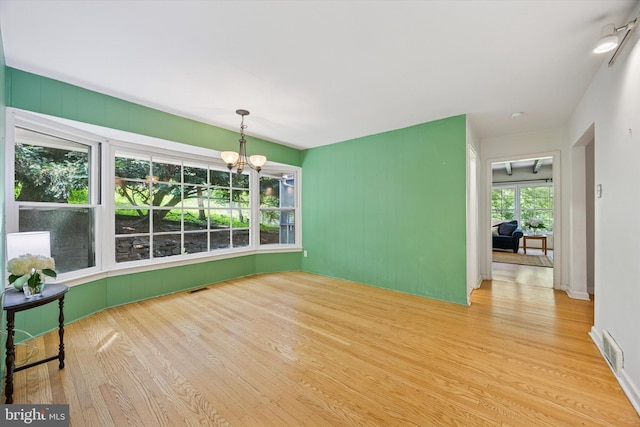 343 Michigan Ave, Swarthmore, PA 19081 - unfurnished room with wood finished floors and a chandelier