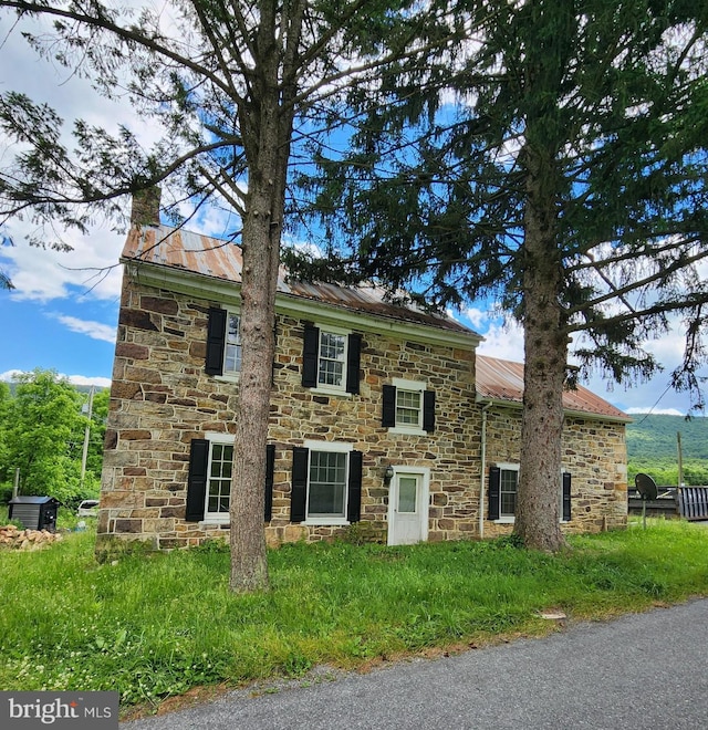 13938 Creek Rd, Willow Hill, PA 17271 - colonial house with stone siding, a chimney, and metal roof