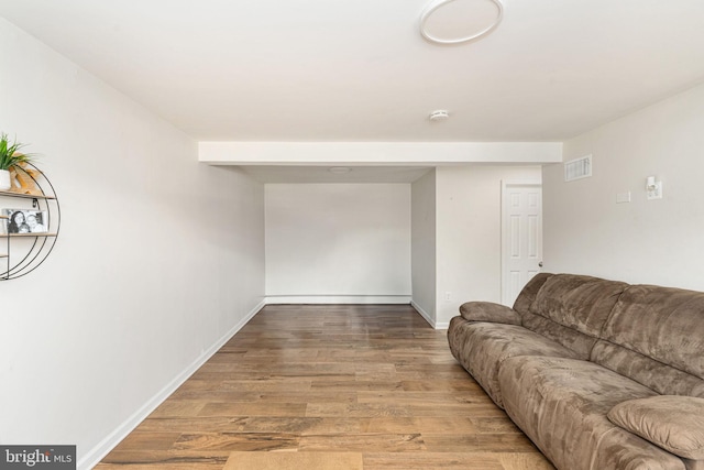 living room featuring wood finished floors and baseboards