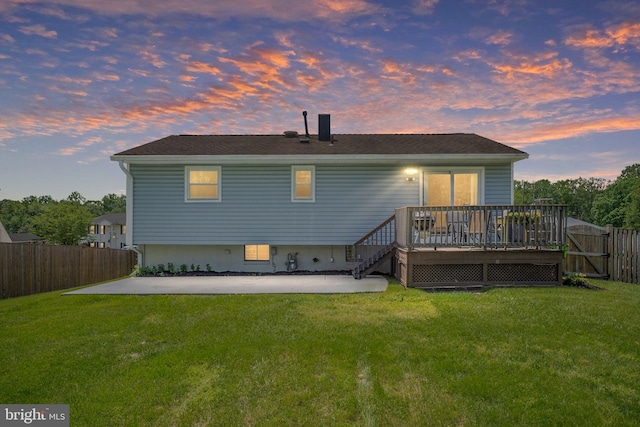 back of house with a patio area, a deck, and a gate