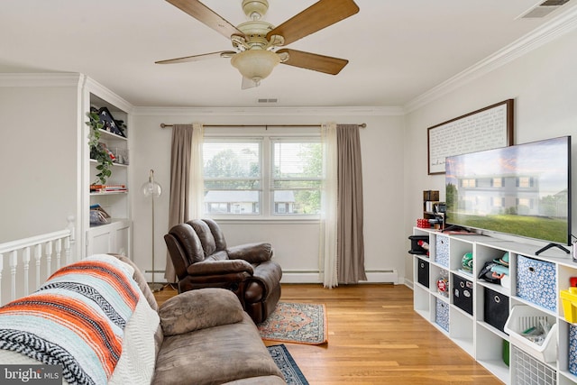 living room featuring ceiling fan, ornamental molding, a baseboard heating unit, light wood-type flooring, and baseboard heating