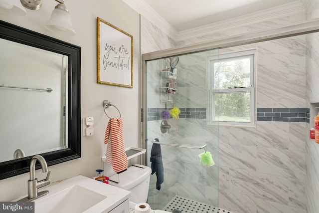 bathroom with a stall shower, crown molding, toilet, and vanity
