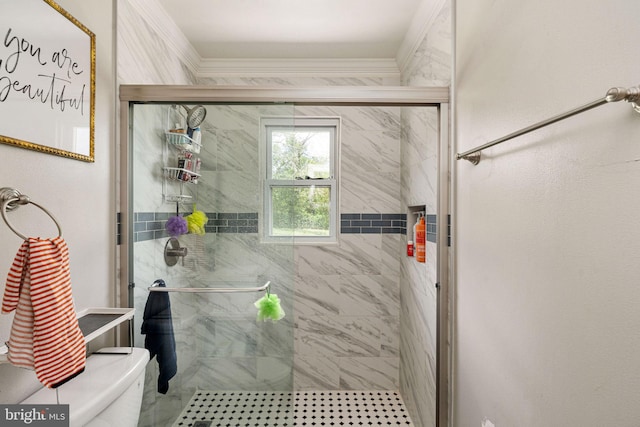 bathroom featuring a shower stall, ornamental molding, and toilet