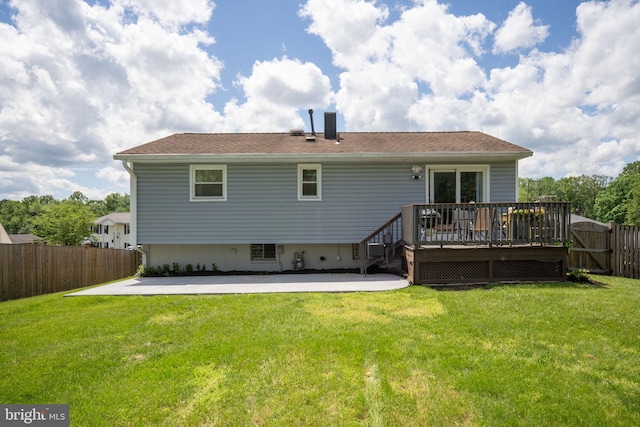 back of house with a patio, a deck, and a chimney