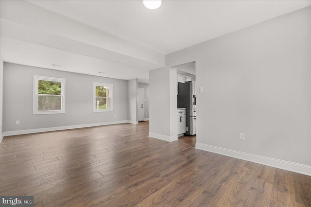 6121 Ducketts Ln, Elkridge, MD 21075 - empty room featuring baseboards and dark wood-style flooring