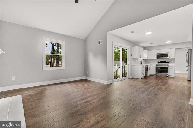 6121 Ducketts Ln, Elkridge, MD 21075 - unfurnished living room featuring dark wood-style floors, lofted ceiling, baseboards, a sink, and recessed lighting