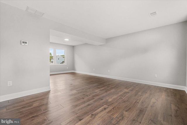 6121 Ducketts Ln, Elkridge, MD 21075 - spare room with dark wood-type flooring, baseboards, and recessed lighting