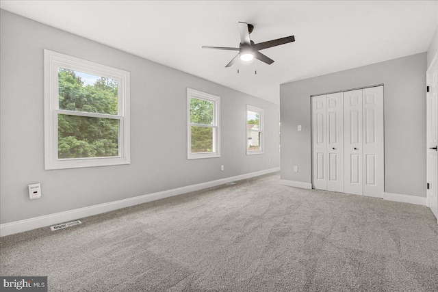 6121 Ducketts Ln, Elkridge, MD 21075 - unfurnished bedroom with baseboards, a closet, carpet flooring, and a ceiling fan