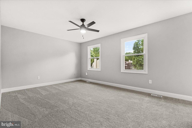 6121 Ducketts Ln, Elkridge, MD 21075 - carpeted spare room with a ceiling fan and baseboards