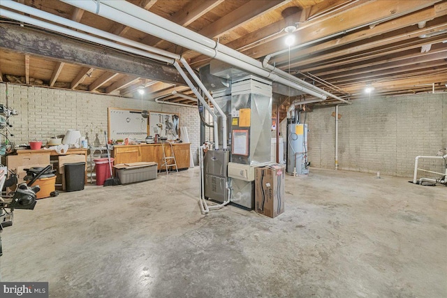 6121 Ducketts Ln, Elkridge, MD 21075 - unfinished below grade area with gas water heater, heating unit, brick wall, and a workshop area