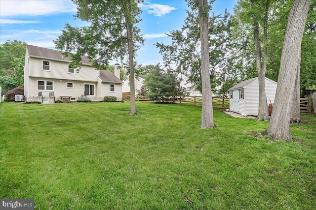 6121 Ducketts Ln, Elkridge, MD 21075 - view of yard featuring an outdoor structure, a storage shed, and central AC unit