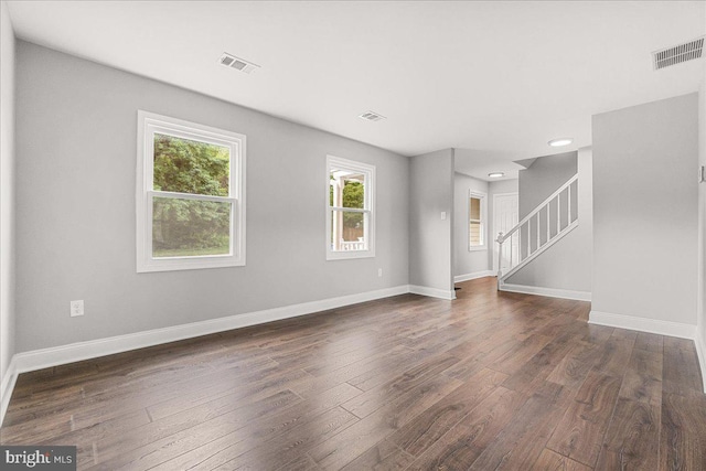 6121 Ducketts Ln, Elkridge, MD 21075 - unfurnished living room with dark wood finished floors, stairway, baseboards, and recessed lighting