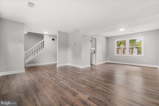 6121 Ducketts Ln, Elkridge, MD 21075 - unfurnished living room with stairs, dark wood-style flooring, baseboards, recessed lighting, and a sink