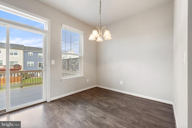 105 Poinsettia Way, Stephenson, VA 22656 - empty room with wood finished floors, a chandelier, and baseboards