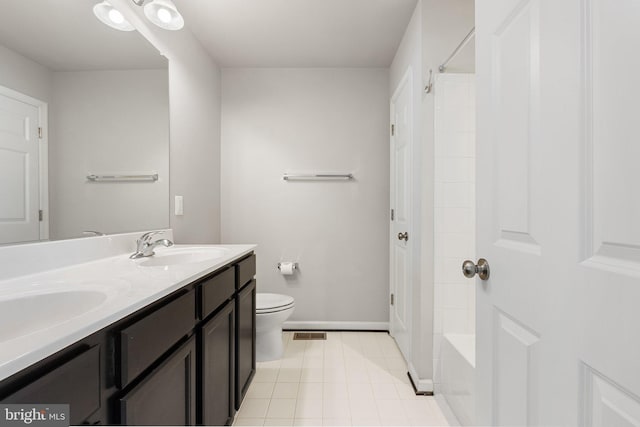 105 Poinsettia Way, Stephenson, VA 22656 - bathroom featuring toilet, tile patterned flooring, double vanity, tub / shower combination, and baseboards