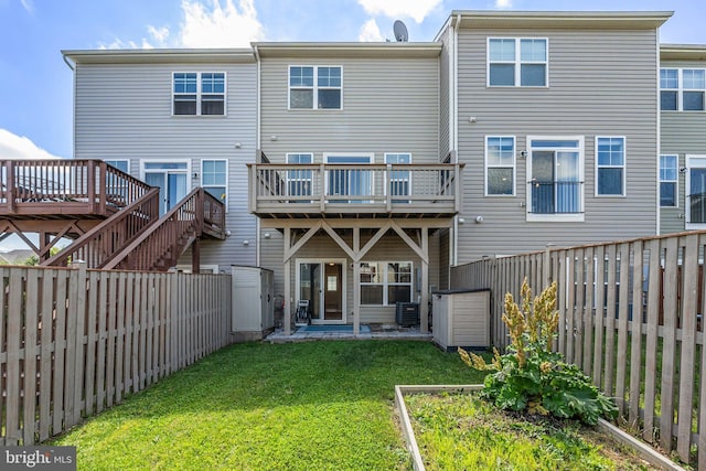 105 Poinsettia Way, Stephenson, VA 22656 - rear view of house with a wooden deck and cooling unit