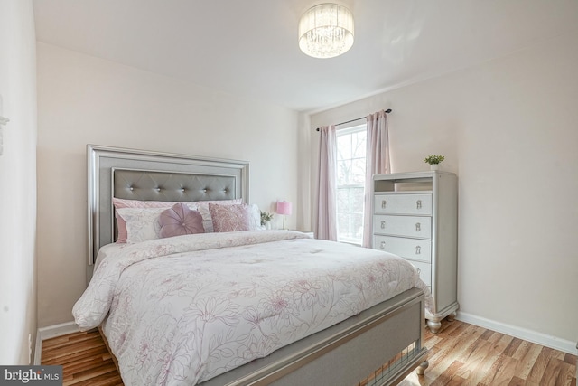16 Rue Chagall, Mays Landing, NJ 08330 - bedroom featuring baseboards, a chandelier, and wood finished floors