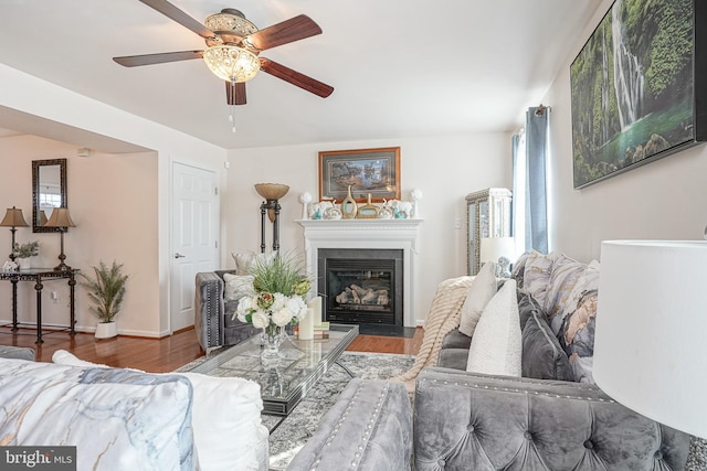 16 Rue Chagall, Mays Landing, NJ 08330 - living room featuring baseboards, wood finished floors, a ceiling fan, and a fireplace with flush hearth