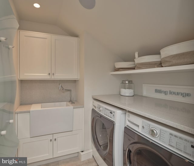 laundry area featuring independent washer and dryer, cabinet space, and recessed lighting