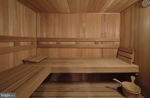 relaxing sauna with wood ceiling and wood walls
