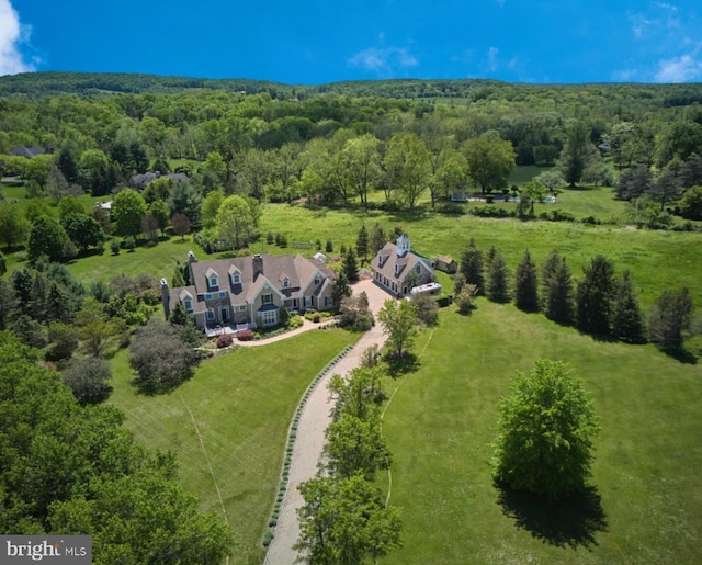 view from above of property with a forest