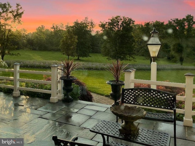 patio terrace at dusk with a yard