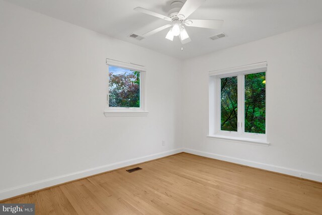 5018 36th St N, Arlington, VA 22207 - unfurnished room with baseboards, light wood-type flooring, and plenty of natural light
