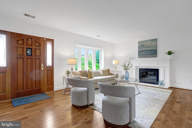 5018 36th St N, Arlington, VA 22207 - living room with hardwood / wood-style floors, a glass covered fireplace, and baseboards