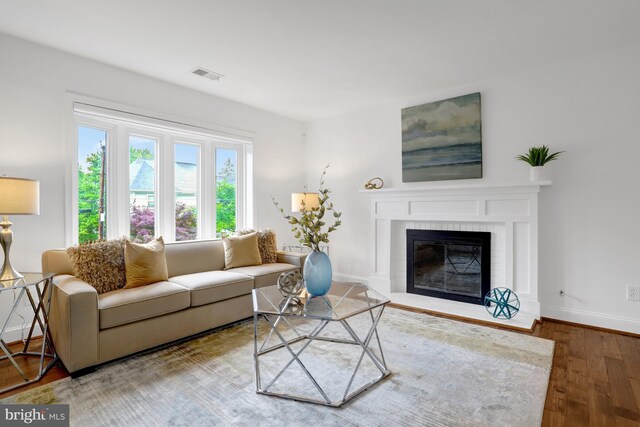 5018 36th St N, Arlington, VA 22207 - living room featuring wood finished floors, baseboards, and a fireplace